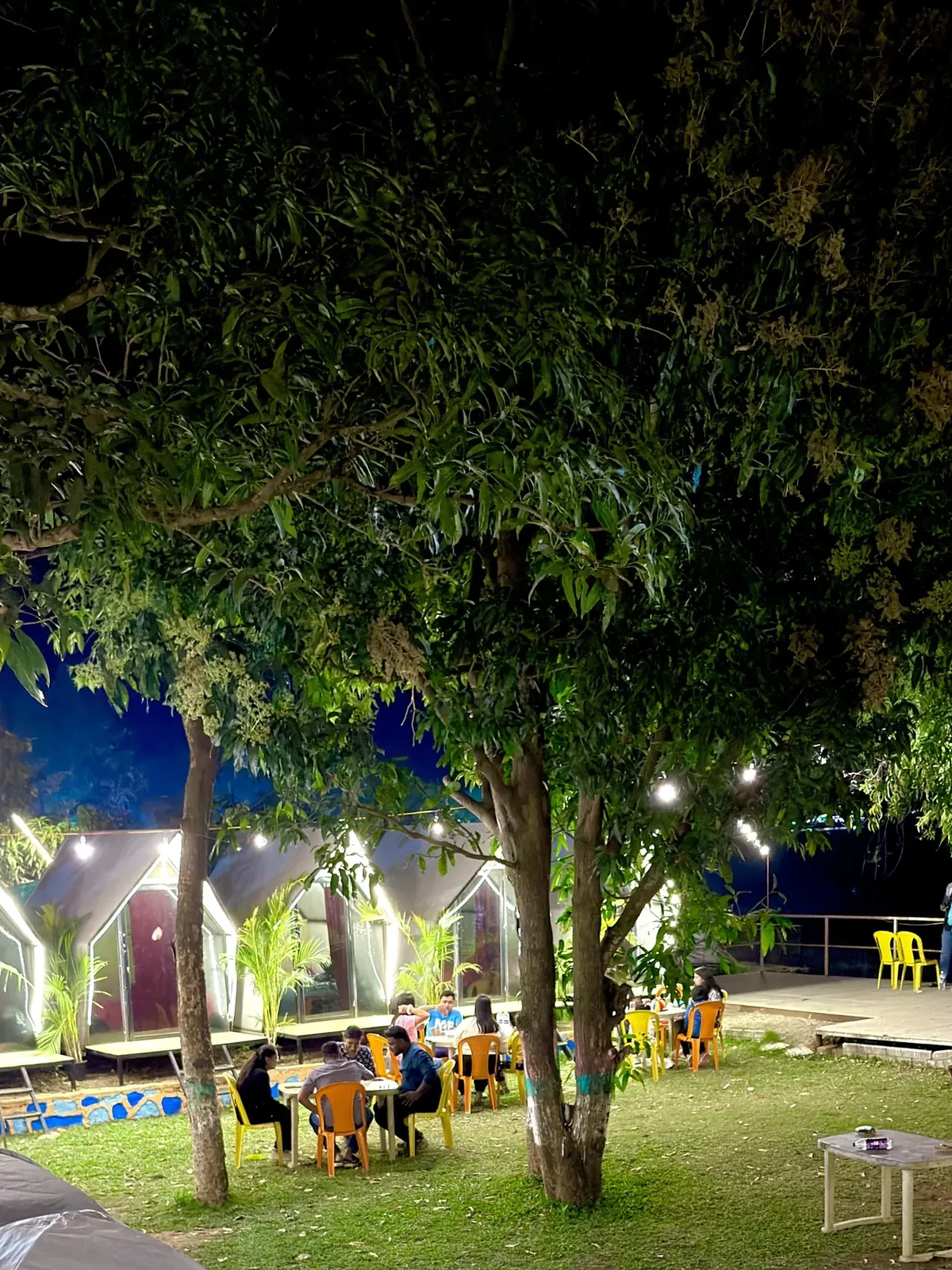 Evening dining area under campsite lights